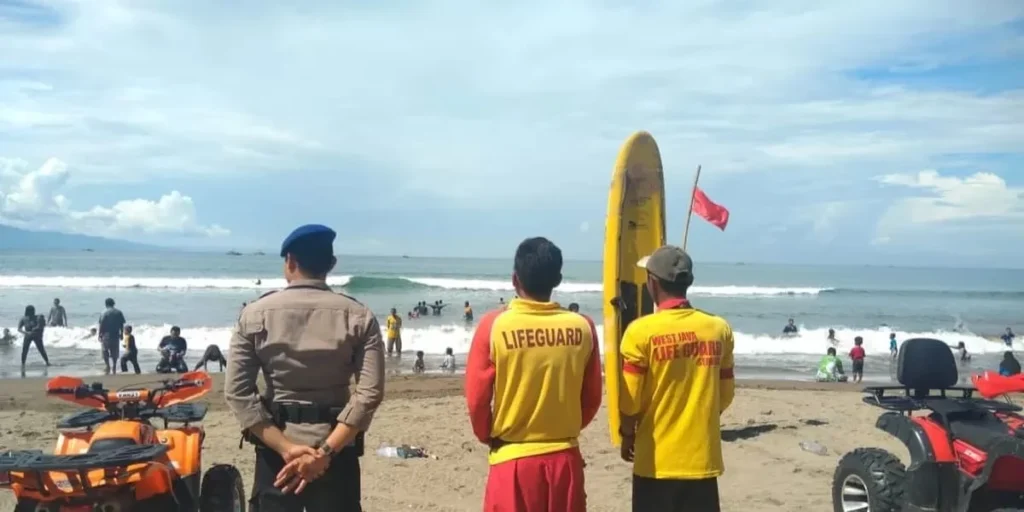 Ilustrasi penjaga pantau atau lifeguard.